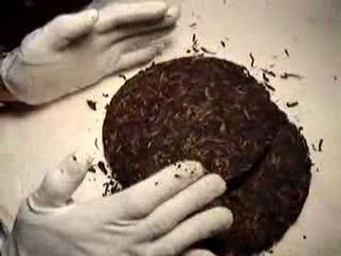 Breaking up a Puerh tea cake