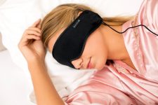 Blonde Woman sleeping with hibermate headphones for sleep and asmr